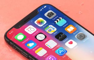 Realistic iPhone X On The Desk PSD Mockup