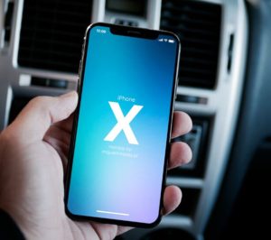 iPhone X In Hand Mockup PSD