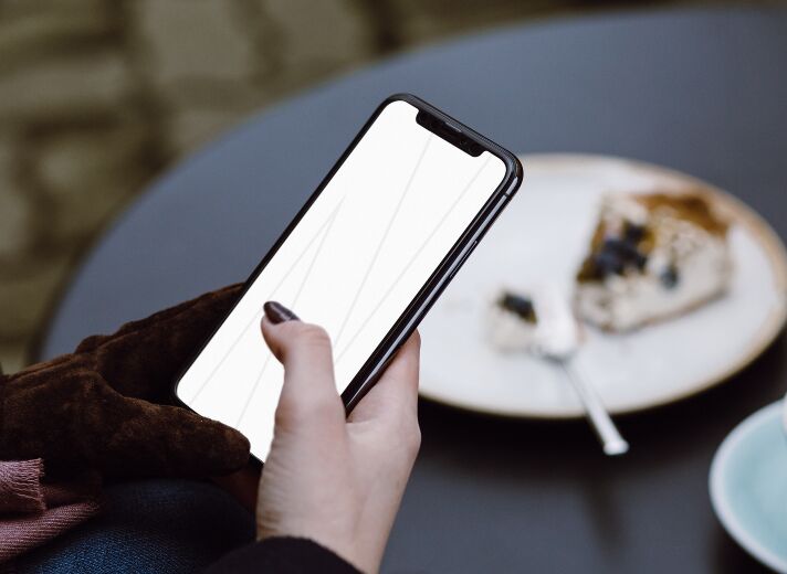 iPhone X Woman Cafe Mockup PSD