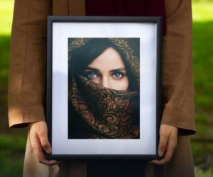 Woman Holding Photo Frame PSD Mockup